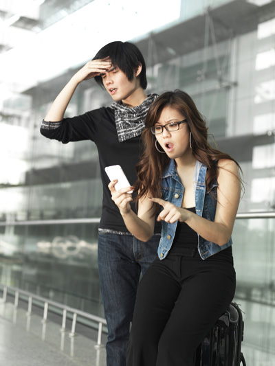Asian Chinese couple dismayed over their flight schedule